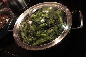 Broccolini cooking in a pan
